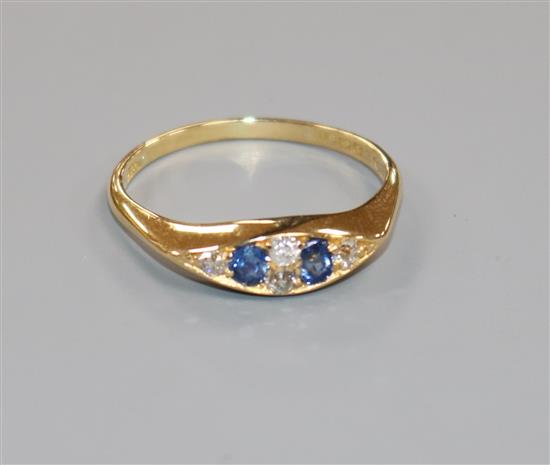 An Edwardian 18ct gold, sapphire and diamond six stone ring, size V.